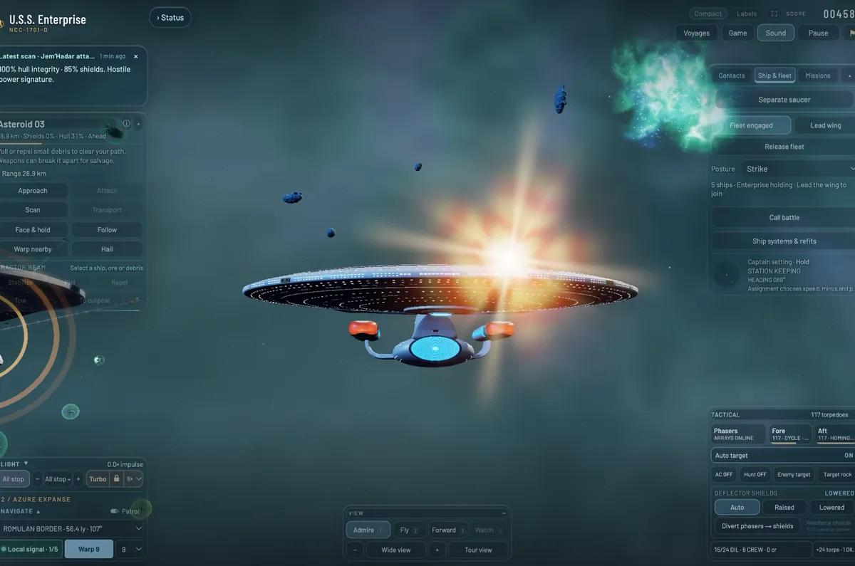 The Enterprise head-on among small asteroids, the deflector dish glowing blue, a bright torpedo burst behind the saucer.
