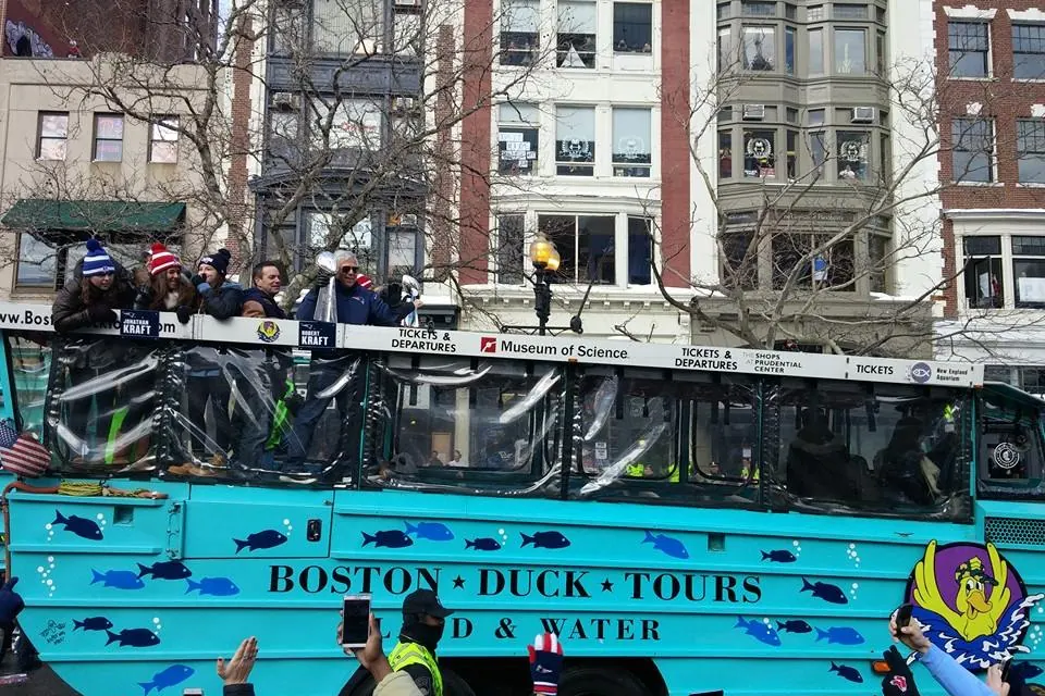 A Boston Duck Tours boat in a championship parade along Boylston Street.